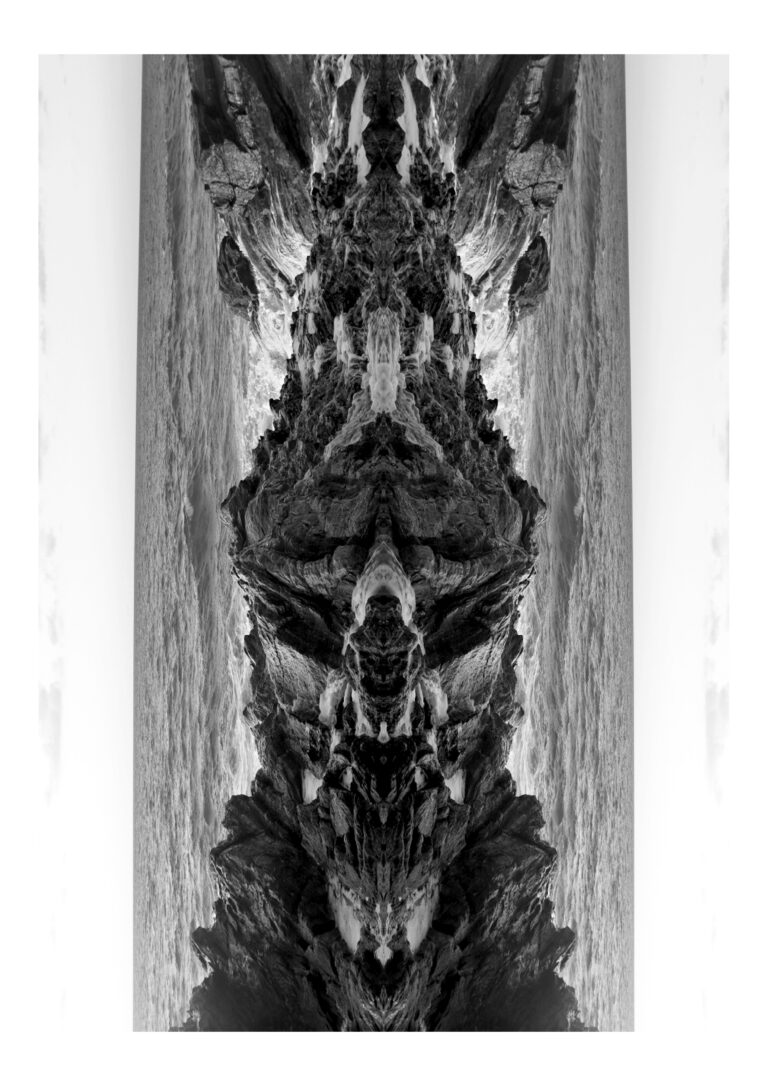Yakamoza - Black and white photography of sea water running down some rock, put in vertical symmetry, giving it a sculptural totem look